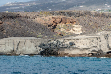 Southern Tenerife coastline from a boat with cliffs and mountains