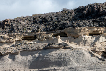 Southern Tenerife coastline from a boat with cliffs and mountains