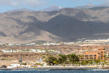 
View of southern Tenerife from a boat with coastline and tourist areas
