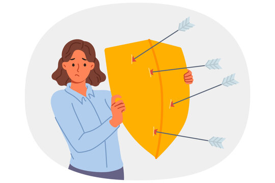 Upset woman defends from arrows of enemies, covering with shield to avoid injury. Girl defends and demonstrates defense mechanism that allows to escape from risk to life of elemental disorder