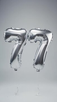 Silver balloon number 77 for birthday or anniversary party