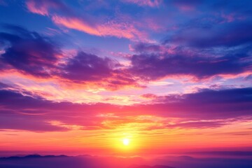 A breathtaking sunset from a mountain peak showcases vivid colors illuminating the sky, creating a peaceful atmosphere filled with a sense of hope and renewal