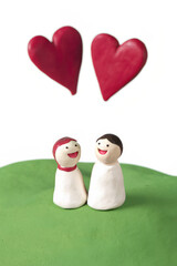Valentine's clay, Clay couple under minimal heart shaped fireworks, expressing love and joy in playful scene