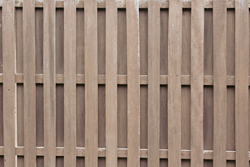 Natural textured background of dark brown plank and panel wood wall, featuring real processed wood board and plank material, for rustic, farmhouse, vintage design theme as a backdrop or copy space