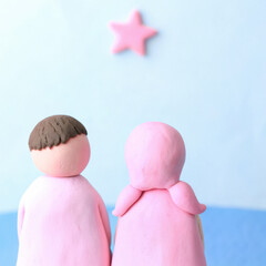 Valentine's clay, Clay couple looking at minimalist night sky with star, evoking sense of wonder and connection