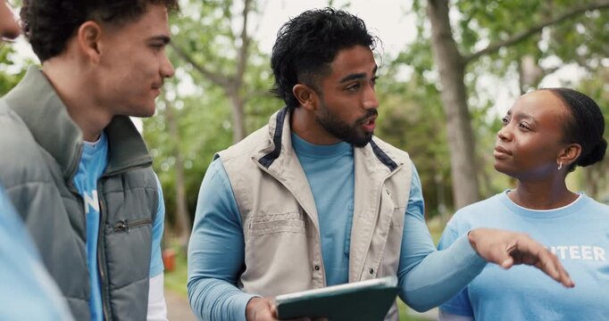 Volunteer, outdoor and people in meeting, tablet and conversation with social responsibility. Group, men and women in park, tech and discussion with charity event, community service and digital app