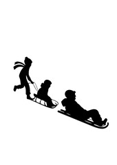Family or Children Sledding and Playing in Snow Silhouette