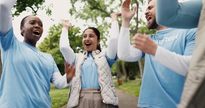 Volunteer, people outdoor or hands together with success for NGO donation, outreach or nonprofit service. Below, team clap or huddle in park for charity achievement, social responsibility or project.