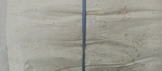 Old Brown Wrinkled Paper Wrapped Parcel Tied String