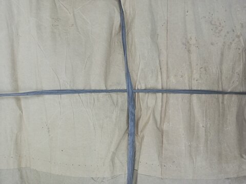 Tightly Tied Brown Kraft Paper Parcel Knot Background