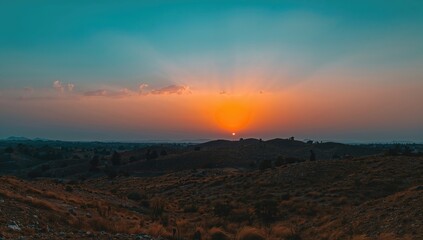 Obraz premium Sunset over the horizon, showcasing vibrant hues and natural beauty, seasonal change