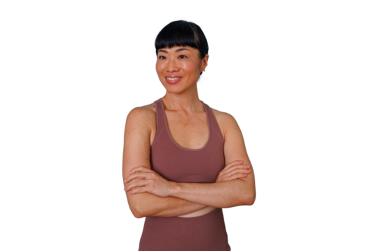 Businesswoman with curly hair smiling, pointing up and right, presenting information or an idea on transparent background