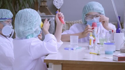 Children in protective gear engaging in hands-on chemistry experiment, curiosity and learning practical laboratory work, Science education, scientific discovery and mixing colorful chemical solutions - Powered by Adobe
