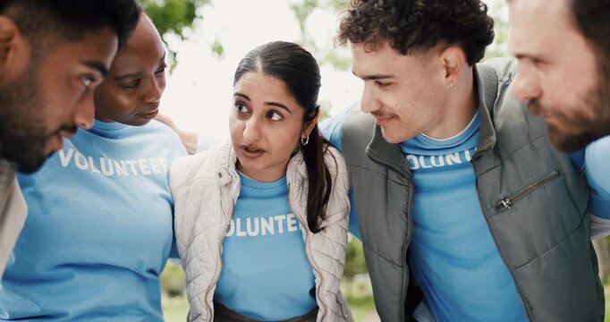 Volunteer, people outdoor or hug with talk for NGO support, nonprofit service or outreach program. Team, embrace or huddle in park for charity work discussion, social responsibility or project goals.