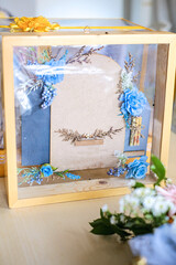 Decorative wooden box with blue floral accents for wedding or gift