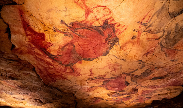 A painting of a horse and other animals on a wall. The painting is very old and has a lot of detail. The mood of the painting is very interesting and mysterious - Powered by Adobe