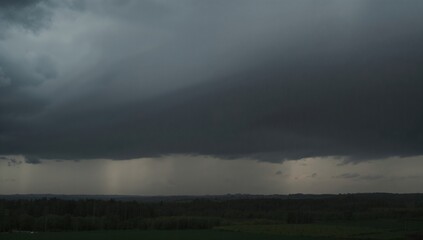 Fototapeta premium Dark storm clouds gathering in a rainy season, erosion risk