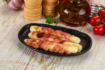 Hot mozzarella sticks with bacon