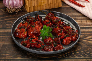 Baked cheeryy momatoes with olive oil