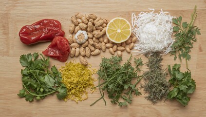 Top view of assorted fresh vegetables including paprika, peanut, garlic, and lemon, fiber-dense choice