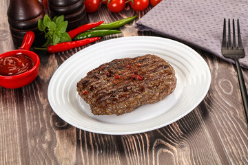 Grilled beef burger cutlet with sauce