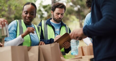 Packing, food drive and volunteers with boxes outdoor for nonprofit, charity or community outreach. Groceries, helping and group of people with parcels for donation with social responsibility in park - Powered by Adobe