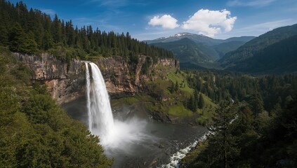 Fototapeta premium Vertical perspective of a cascading waterfall from a towering, forested cliff, erosion risk
