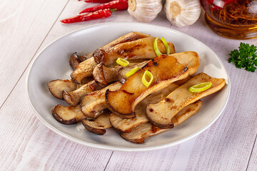 Roasted eringi mushrooms in the plate