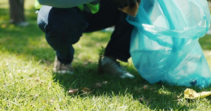 Cleaning, hands and recycling with volunteer outdoor for charity, community service or sustainability. Conservation, earth day and waste with person on grass field in park for ngo or non profit work