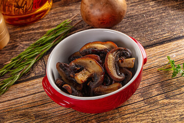 Fried champignon slices in the plate