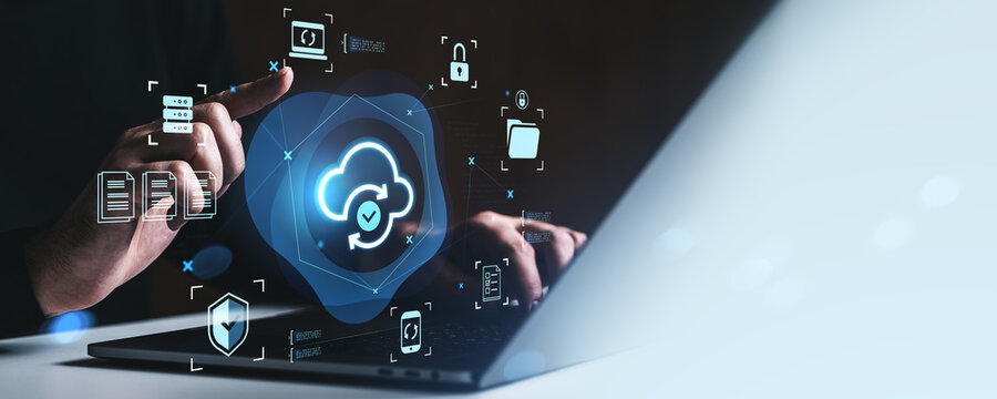 Cloud data synchronization and cybersecurity concept with glowing icons over laptop and hands interacting with digital interface in creative style.