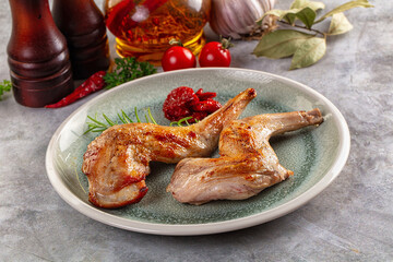 Roasted rabbit leg served rosemary