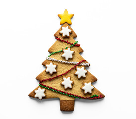 A Christmas tree-shaped cookie with a yellow star on top and white stars and green and red beads on the sides.
