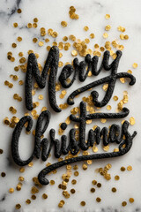 Merry Christmas message with gold accents on bright marble background