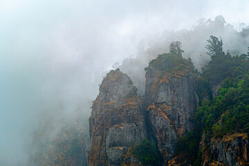 Pillar rocks in fog at Kodaikanal, Kerala, India