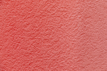 background of structured plaster wall in red
