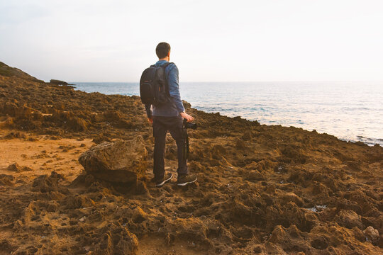 Nature photographer on a rocky coast