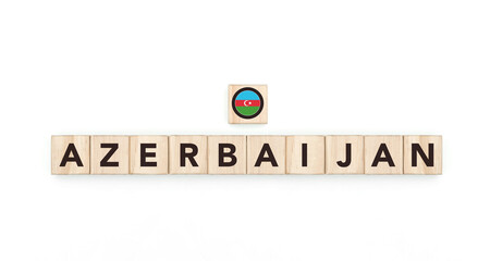 Obraz premium Wooden blocks bearing the name and flag of Azerbaijan. Azerbaijani and Asian Culture, national identity, travel, and geography in a copy space design.