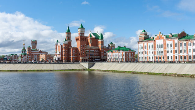 View of the embankment of the Malaya Kokshaga River and the building of the puppet theater in the city of Yoshkar-Ola