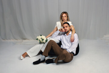 A wedding portrait of the newlyweds. Portrait of a guy and a girl in love