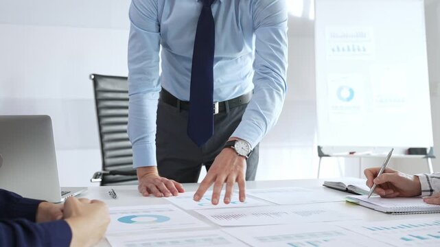 Business people team analyzing financial charts and graphs during strategy meeting in modern office, focusing on corporate planning, and decision making - Powered by Adobe