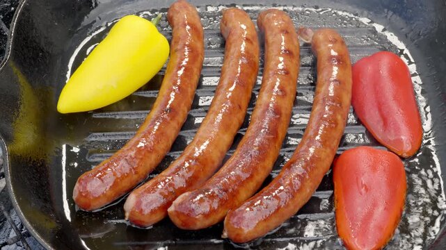 sausages with peppers, homecooked sausage and bell pepper dish with sizzling skillet and inviting aroma