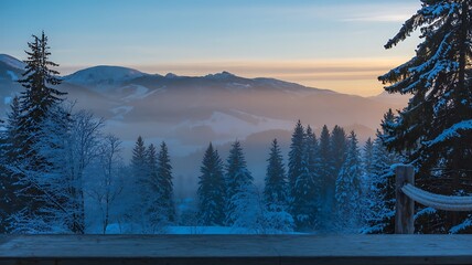 Snow covered trees and mountains create a serene winter landscape view