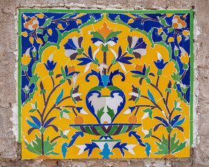 Ancient kashi-kari or faience tile mosaic panel decor with floral motif on historic Asif Khan mughal tomb, Shahdara Bagh, Lahore, Punjab, Pakistan