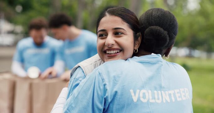 Hug, volunteer and women with smile, outdoor and gratitude with greeting, appreciation and thank you. Charity, people and friends with embrace, community outreach project and kindness with support