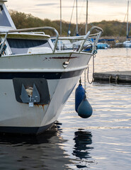 Close up of the front end of a small motor boat moored on the River Bure, Norfolk Broads