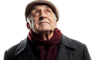 Thoughtful senior man in a cap and coat looking up with a hopeful expression against a showing wisdom and contemplation in old age