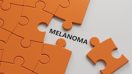 Fototapeta premium The hand puts a puzzle pieces with missing pieces with the letter melanoma. The word is written on puzzle pieces with missing pieces.close up of puzzle pieces with missing pieces,Business Concept.3D