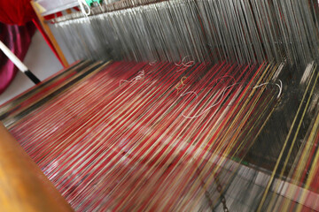 Vintage weaving loom and thread of yarn. Closeup