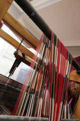 Vintage weaving loom and thread of yarn. Closeup